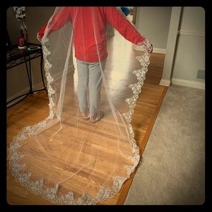 Mantilla style lace cathedral length bridal veil